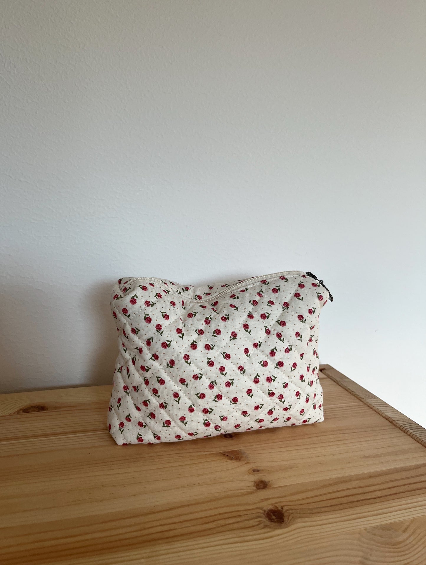 Quilted floral toiletry bag