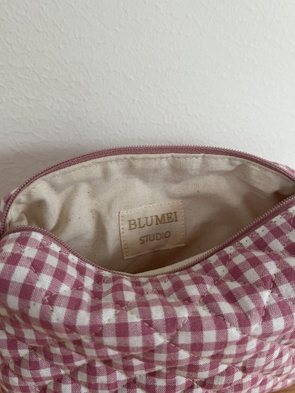 Quiltad rosa rutig necessär